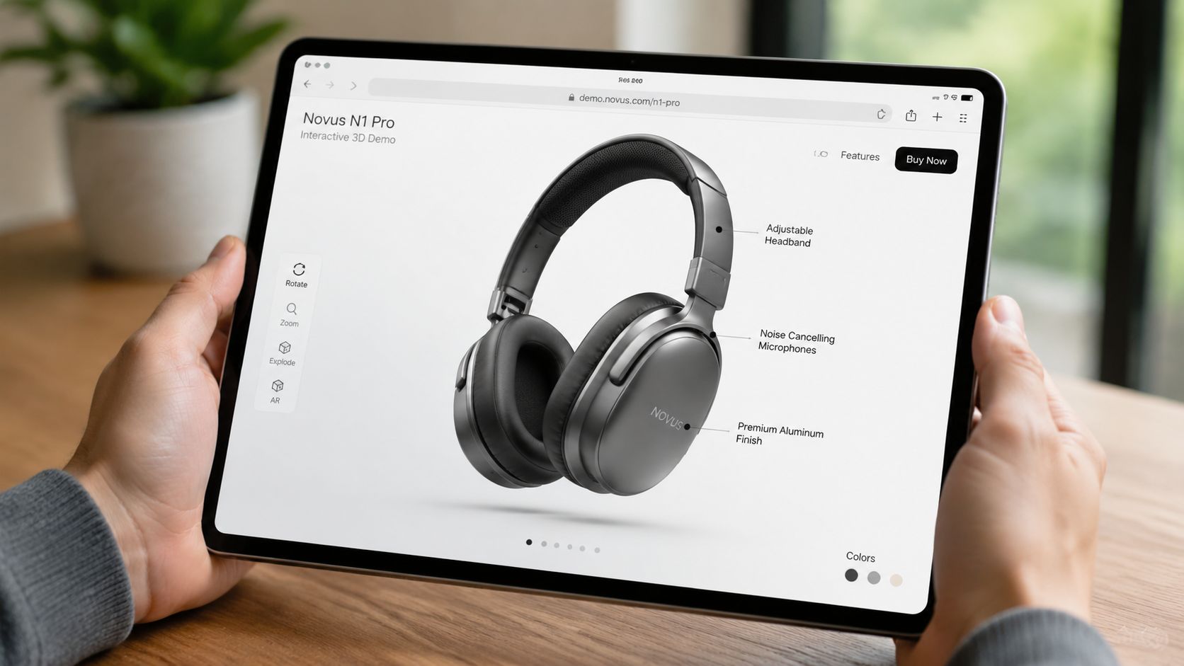 A person holding a tablet displaying an interactive 3D product demonstration of Novus N1 Pro headphones.